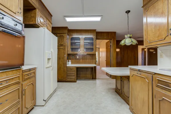 a dining room with a table and chairs