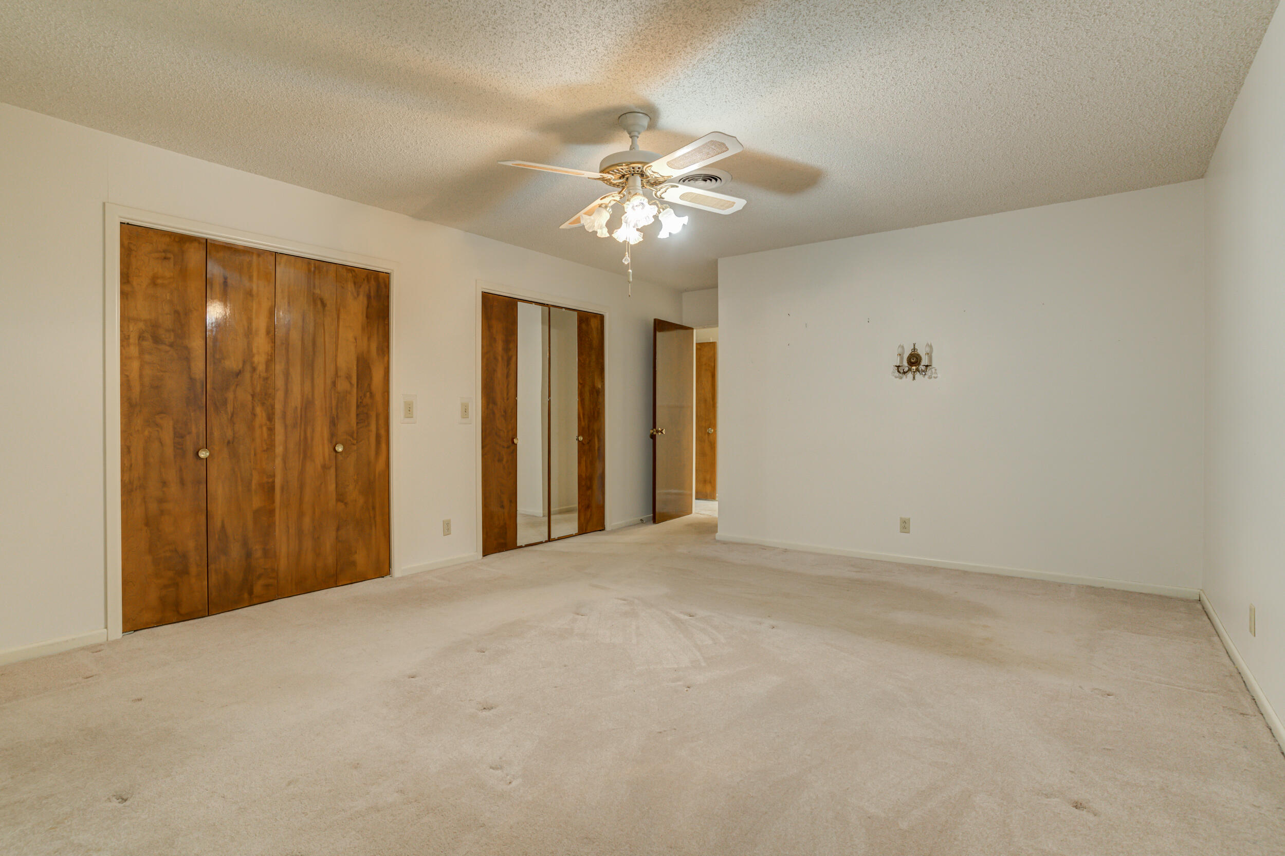 509 18th Street Seagraves, TX 79359 - Photo 17 of 25 a view of an empty room with a ceiling fan