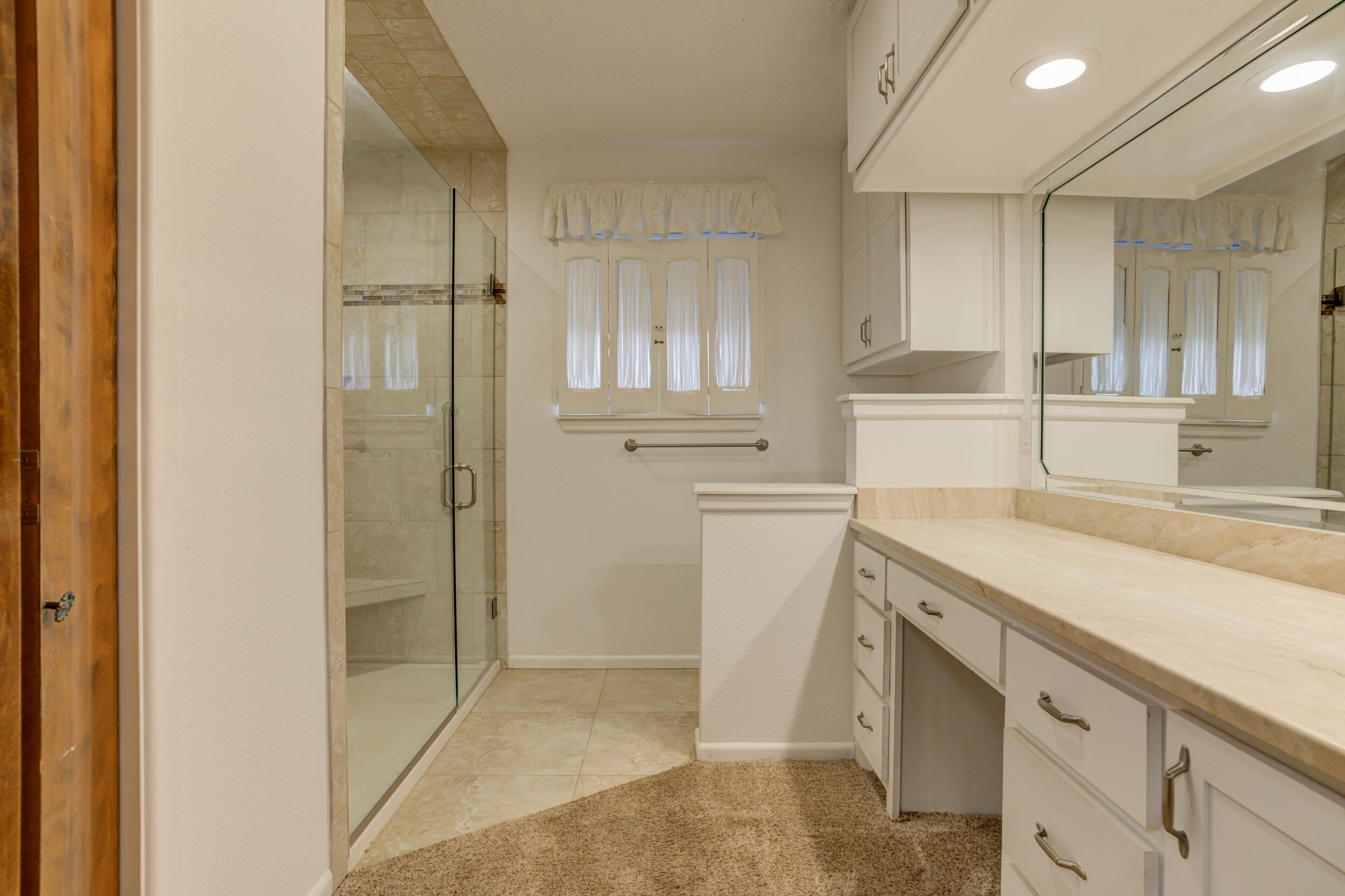 509 18th Street Seagraves, TX 79359 - Photo 19 of 25 a bathroom with a sink and a shower
