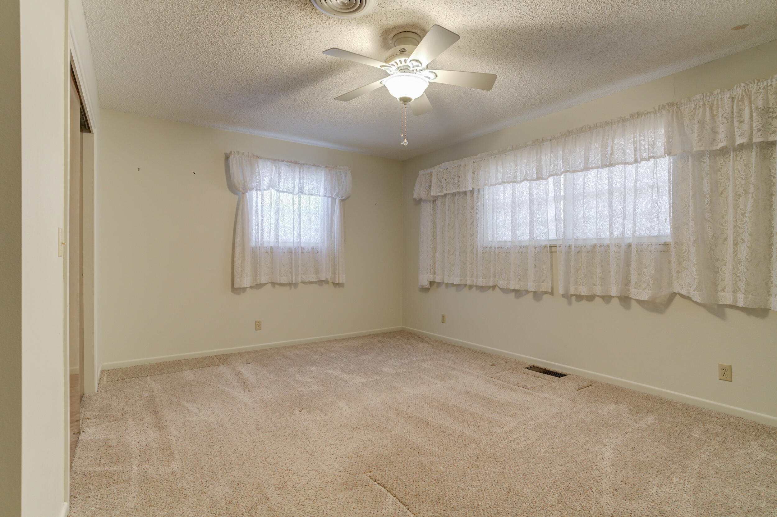509 18th Street Seagraves, TX 79359 - Photo 21 of 25 a view of an empty room with a window