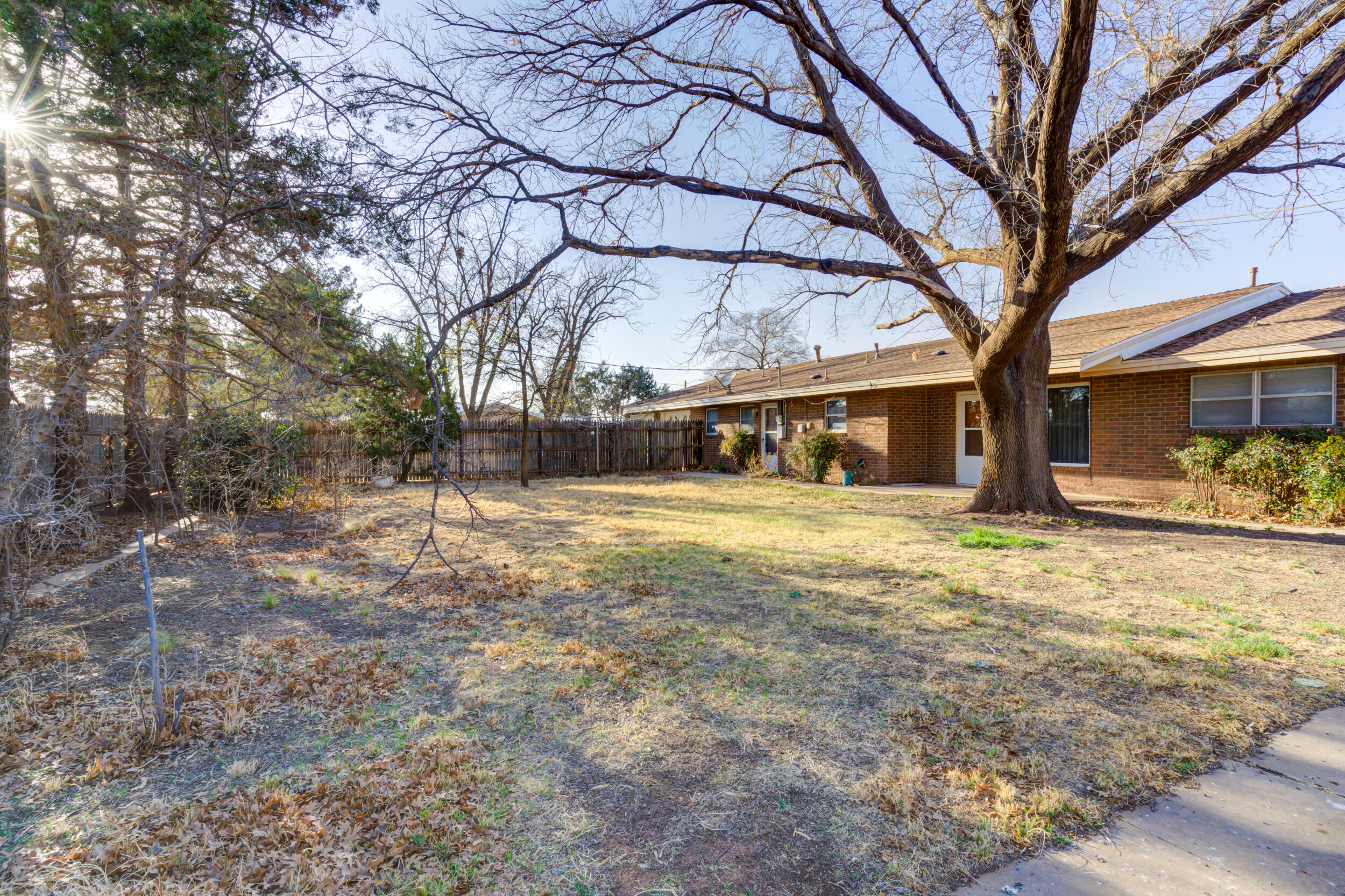 509 18th Street Seagraves, TX 79359 - Photo 4 of 25 a front view of a house with a yard