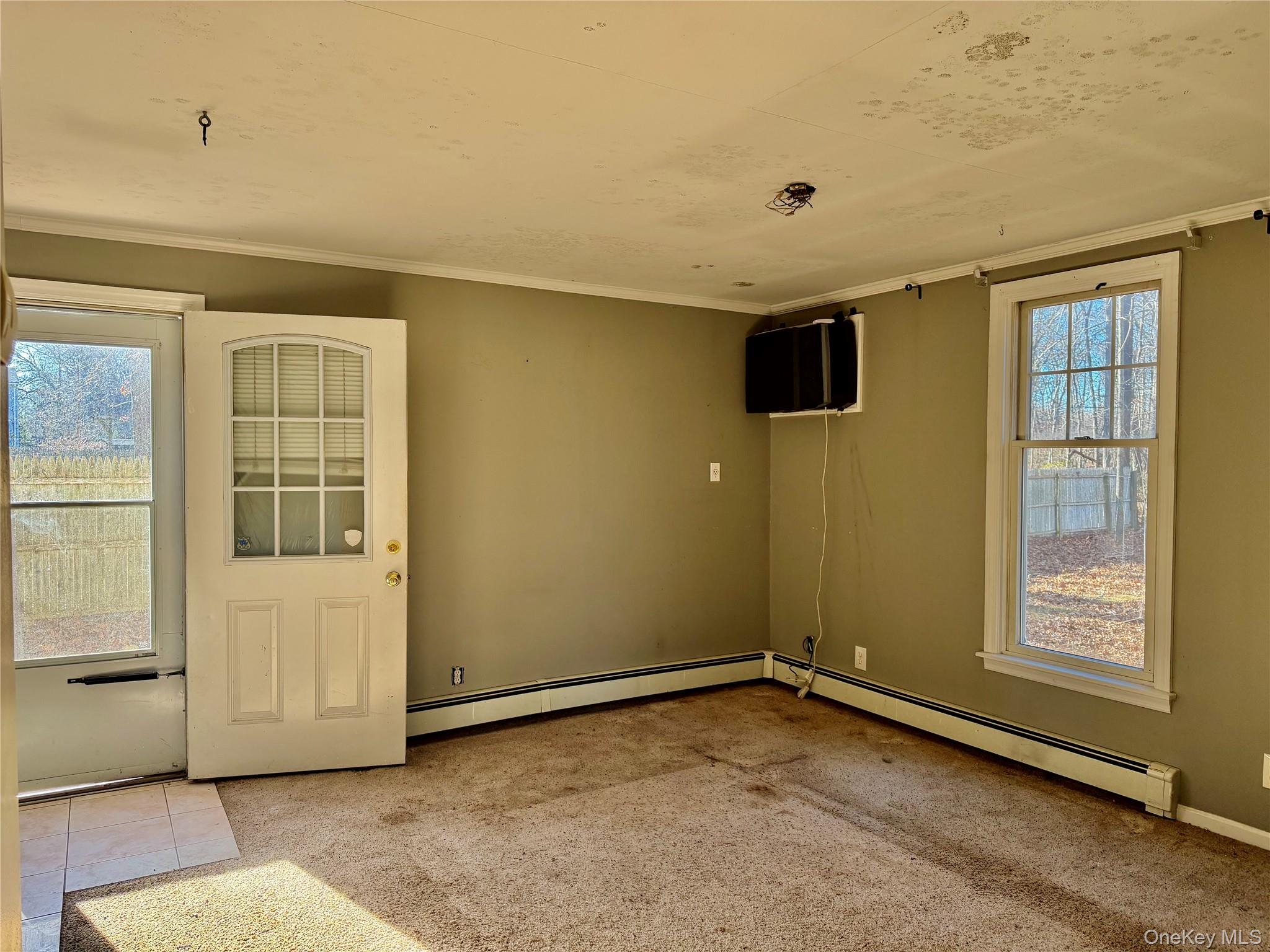 26 North Swezeytown Road Middle Island, NY 11953 - Photo 23 of 27 an empty room with windows