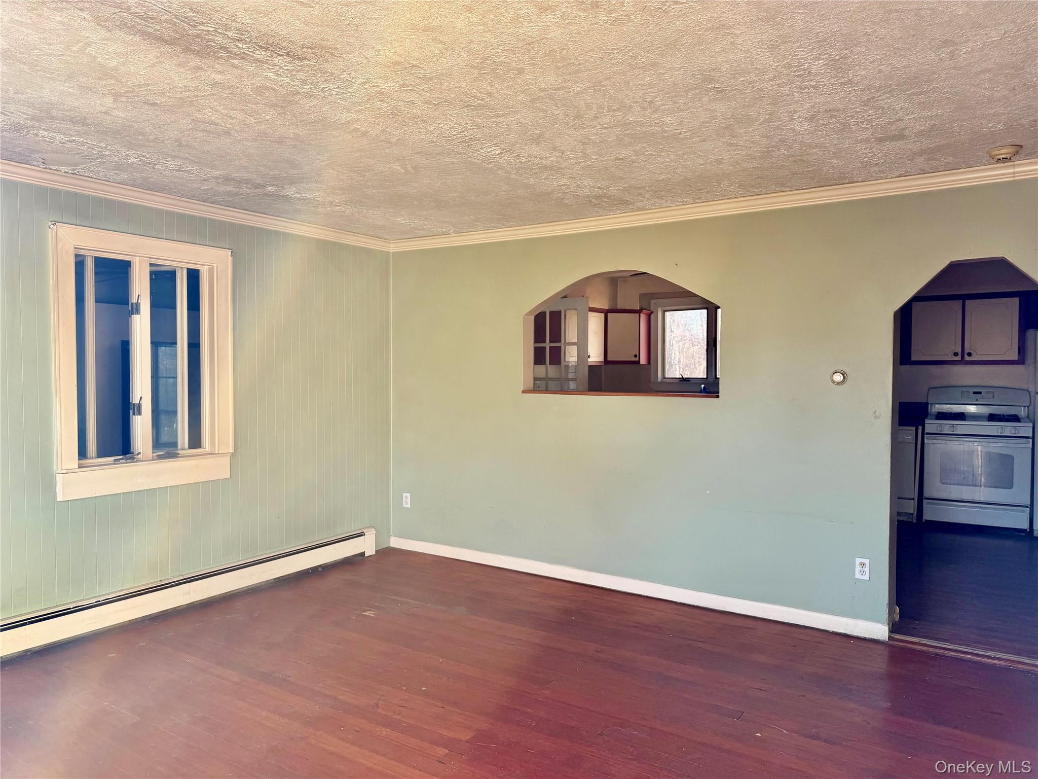 26 North Swezeytown Road Middle Island, NY 11953 - Photo 5 of 27 a view of a room with wooden floor and window