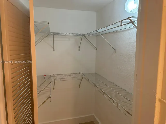 a view of a room with racks on the wall