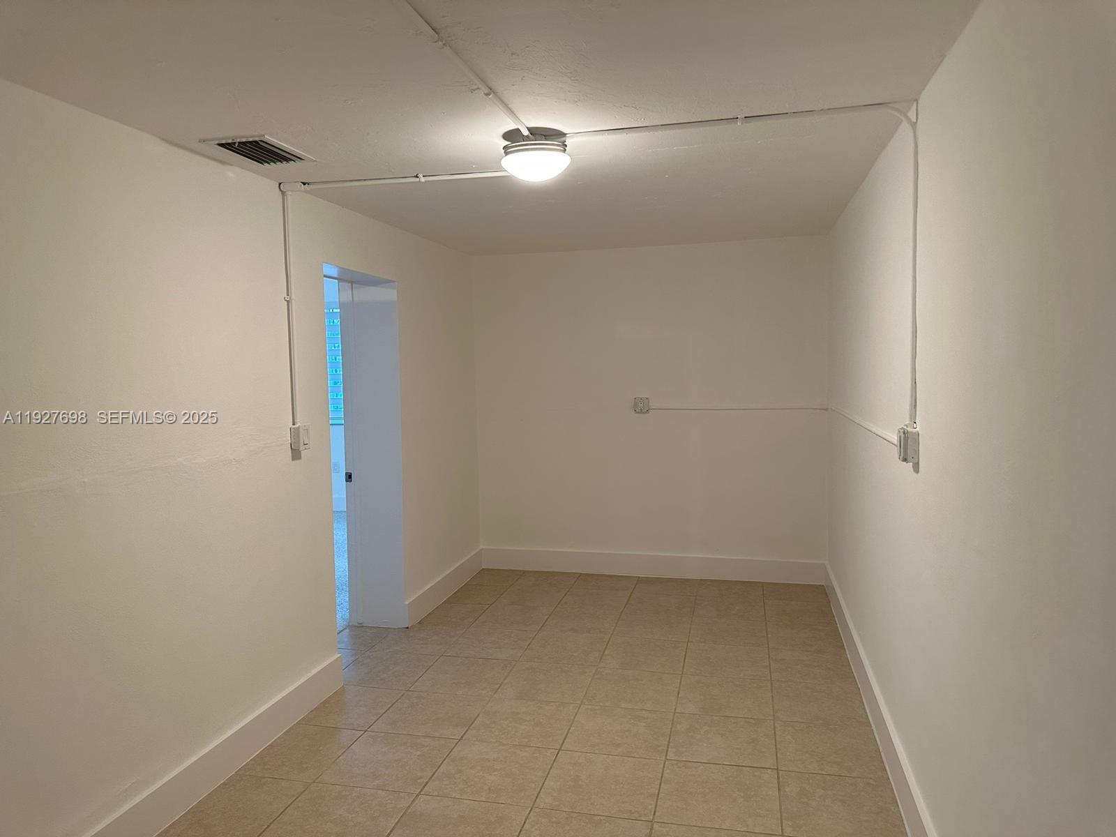 7071 Southwest 4th Street, Unit 2 Miami, FL 33144 - Photo 16 of 27 a view of a room with an empty space