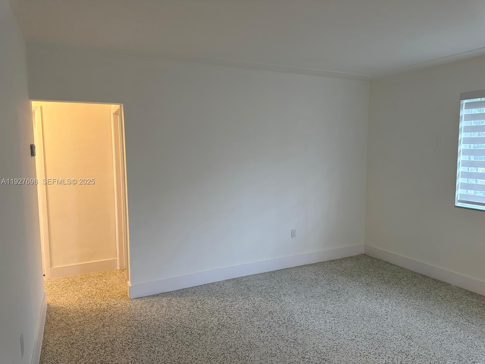 7071 Southwest 4th Street, Unit 2 Miami, FL 33144 - Photo 17 of 27 an empty room with a window