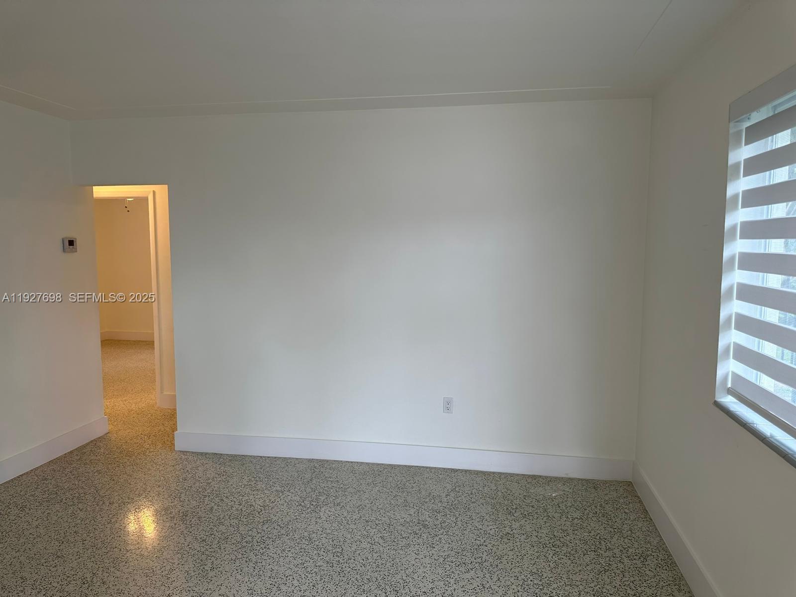 7071 Southwest 4th Street, Unit 2 Miami, FL 33144 - Photo 20 of 27 an empty room with windows