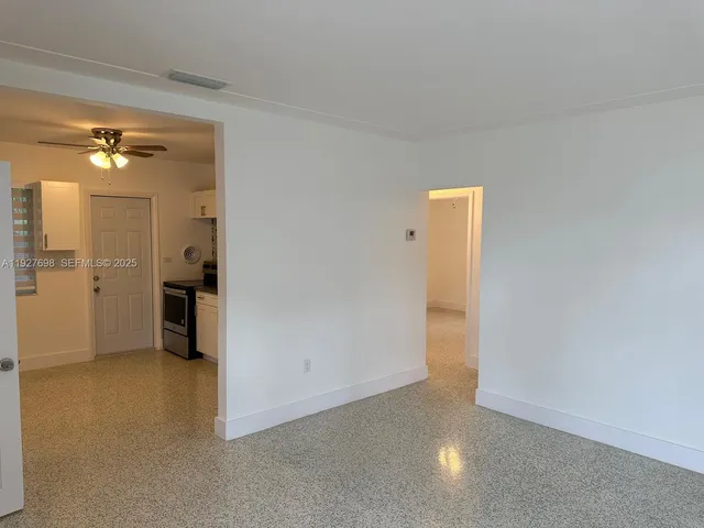 a view of an empty room with a window