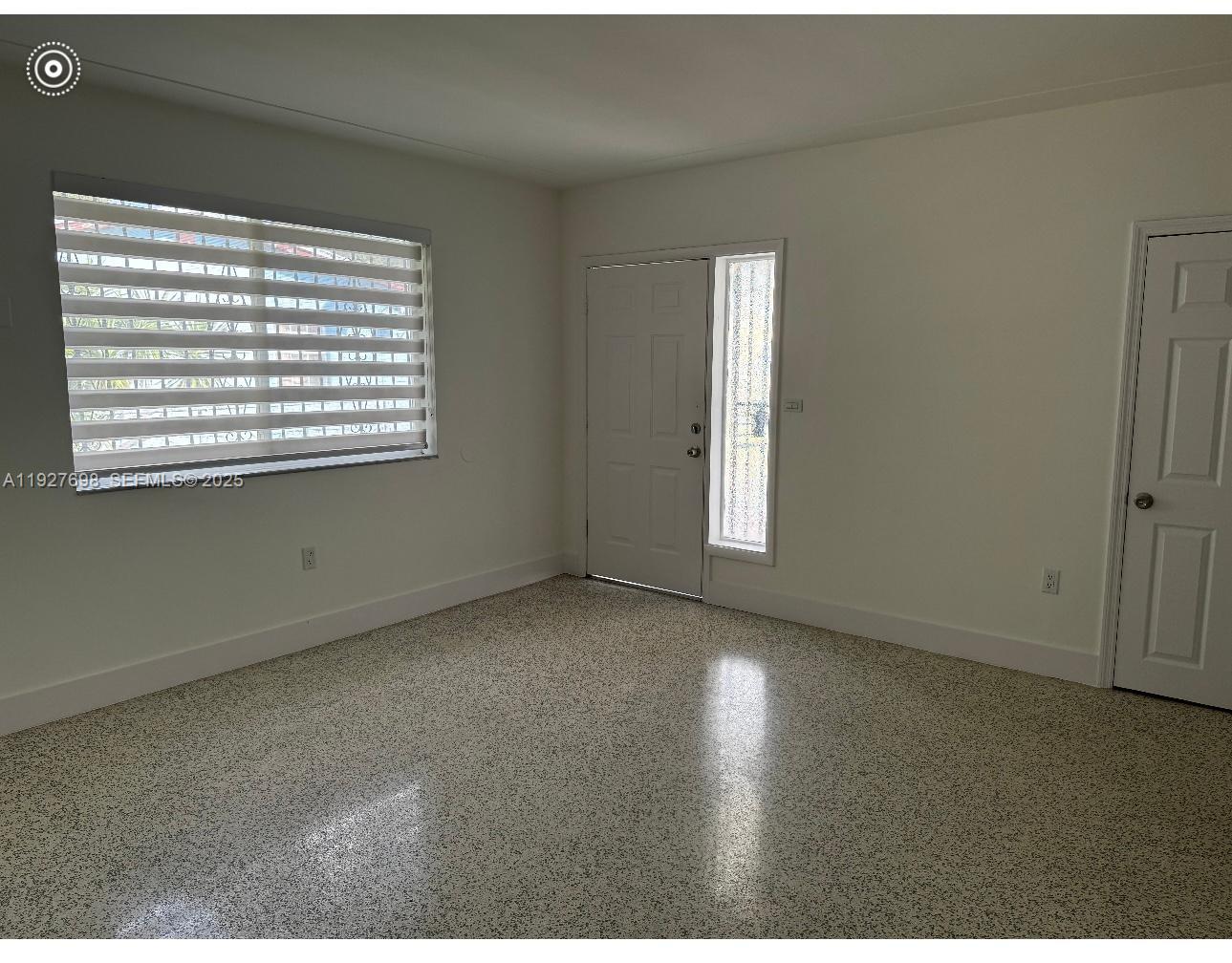 7071 Southwest 4th Street, Unit 2 Miami, FL 33144 - Photo 22 of 27 a view of an empty room with a window