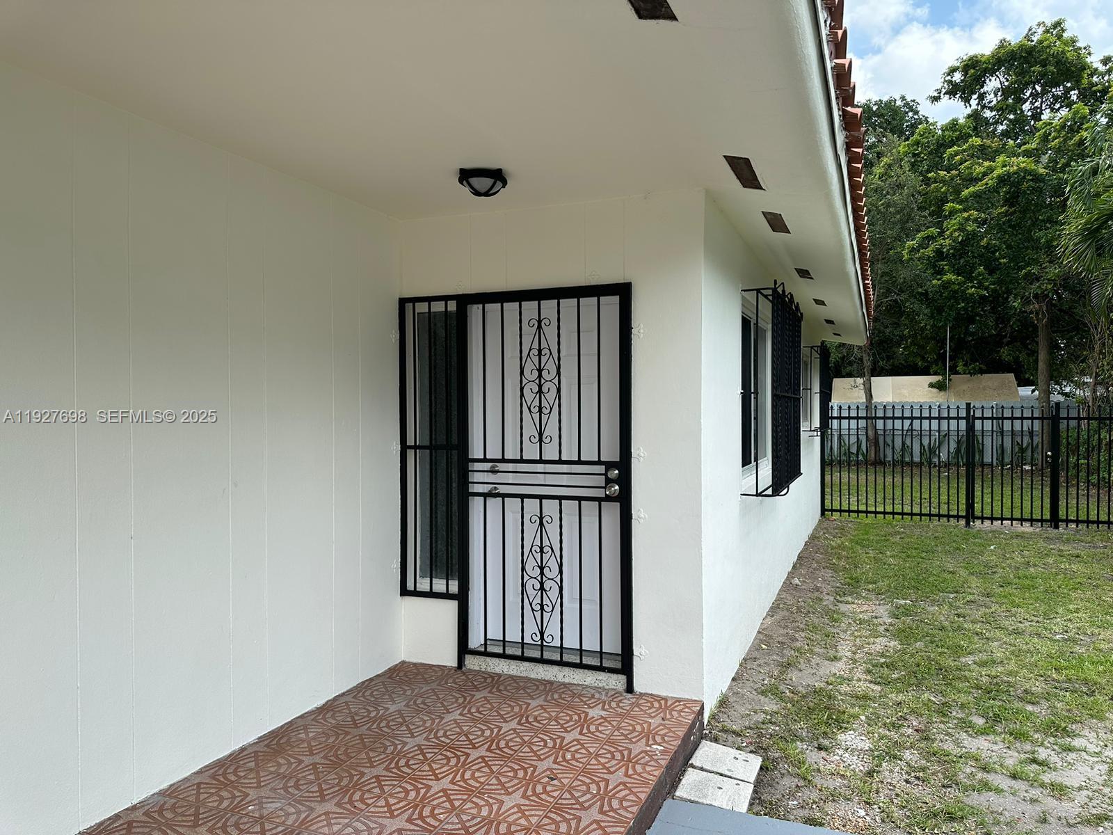 7071 Southwest 4th Street, Unit 2 Miami, FL 33144 - Photo 5 of 27 a view of entryway with livingroom