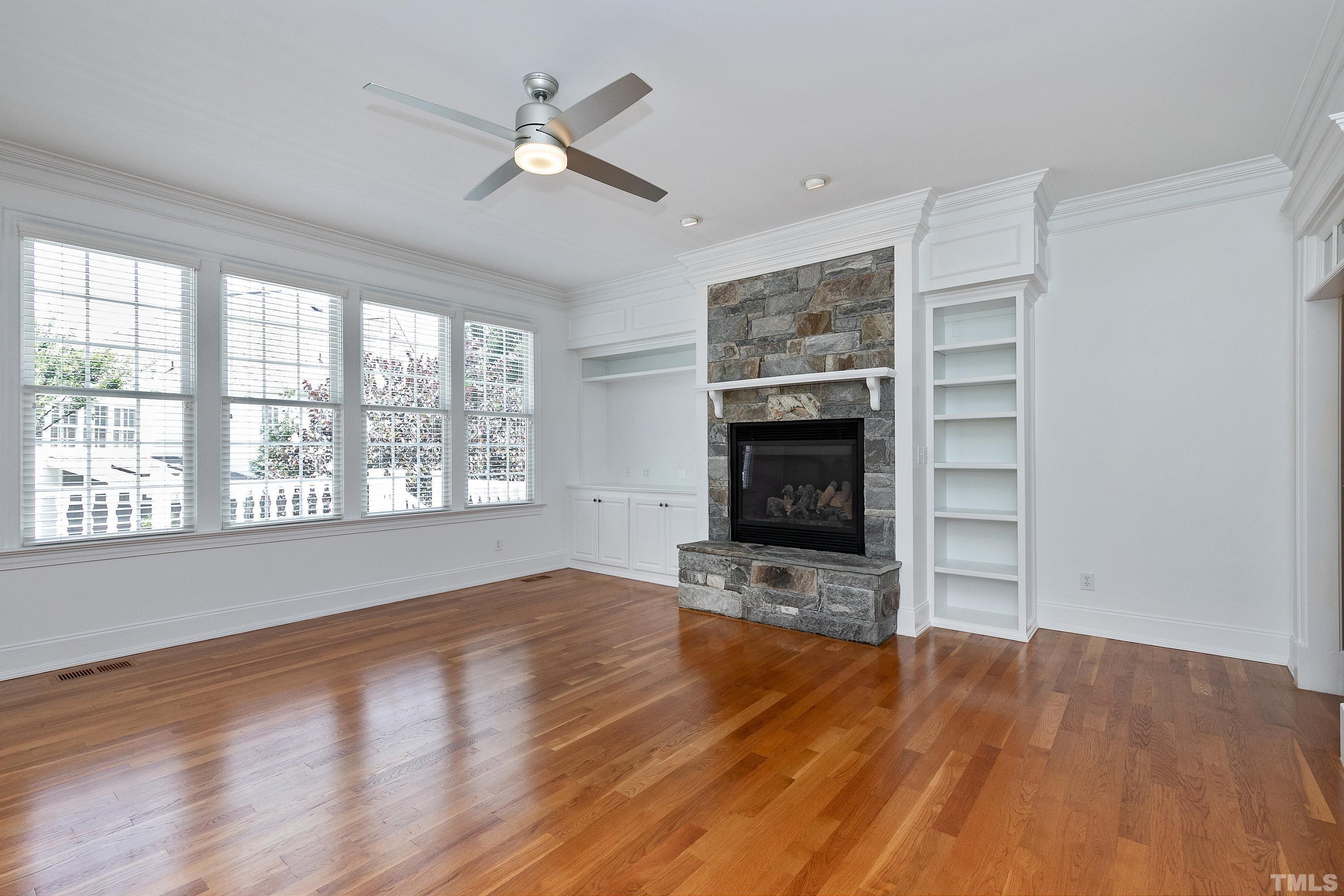 202 Simerville Road Chapel Hill, NC 27517 - Photo 12 of 51 wooden floor fireplace and windows in an empty room