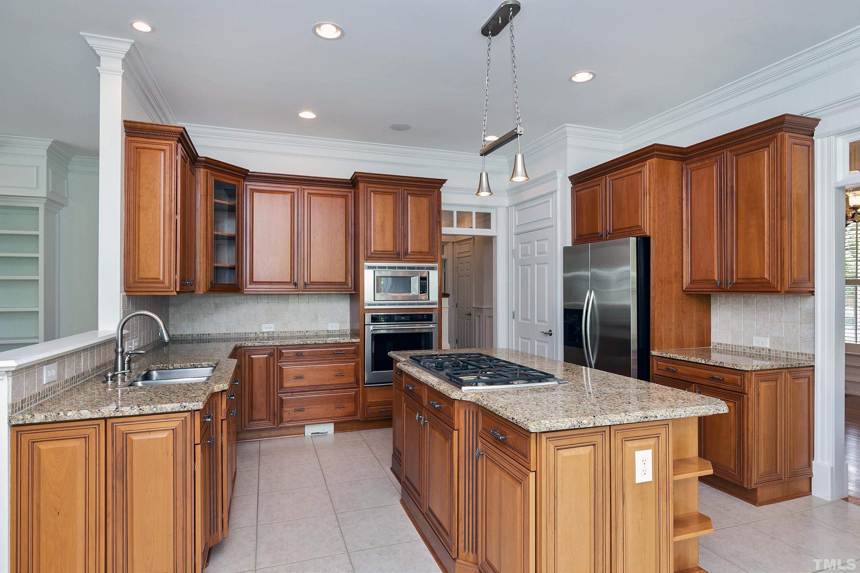 202 Simerville Road Chapel Hill, NC 27517 - Photo 16 of 51 a kitchen with stainless steel appliances granite countertop a sink stove and refrigerator