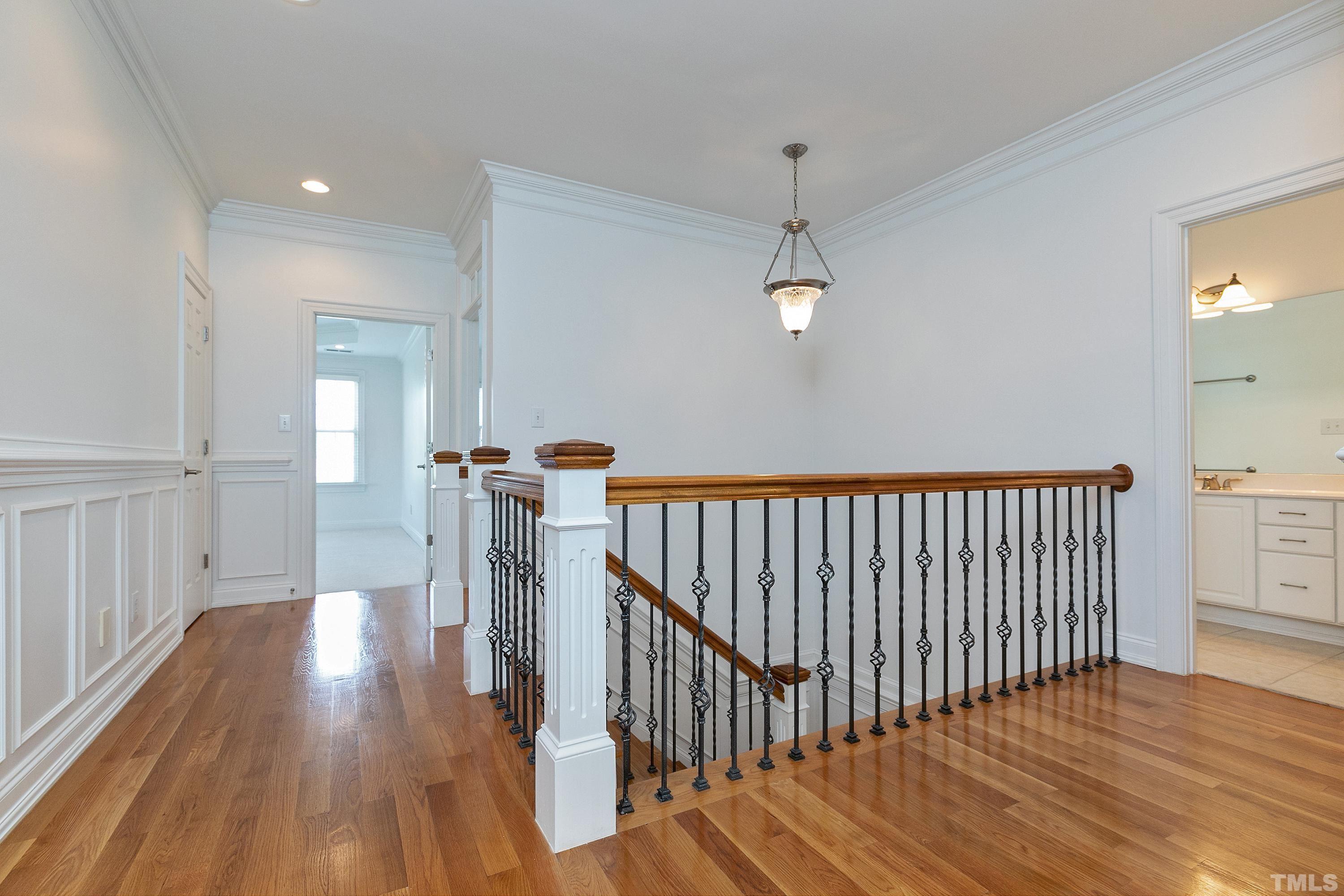 202 Simerville Road Chapel Hill, NC 27517 - Photo 22 of 51 a view of a hallway with wooden floor and stairs