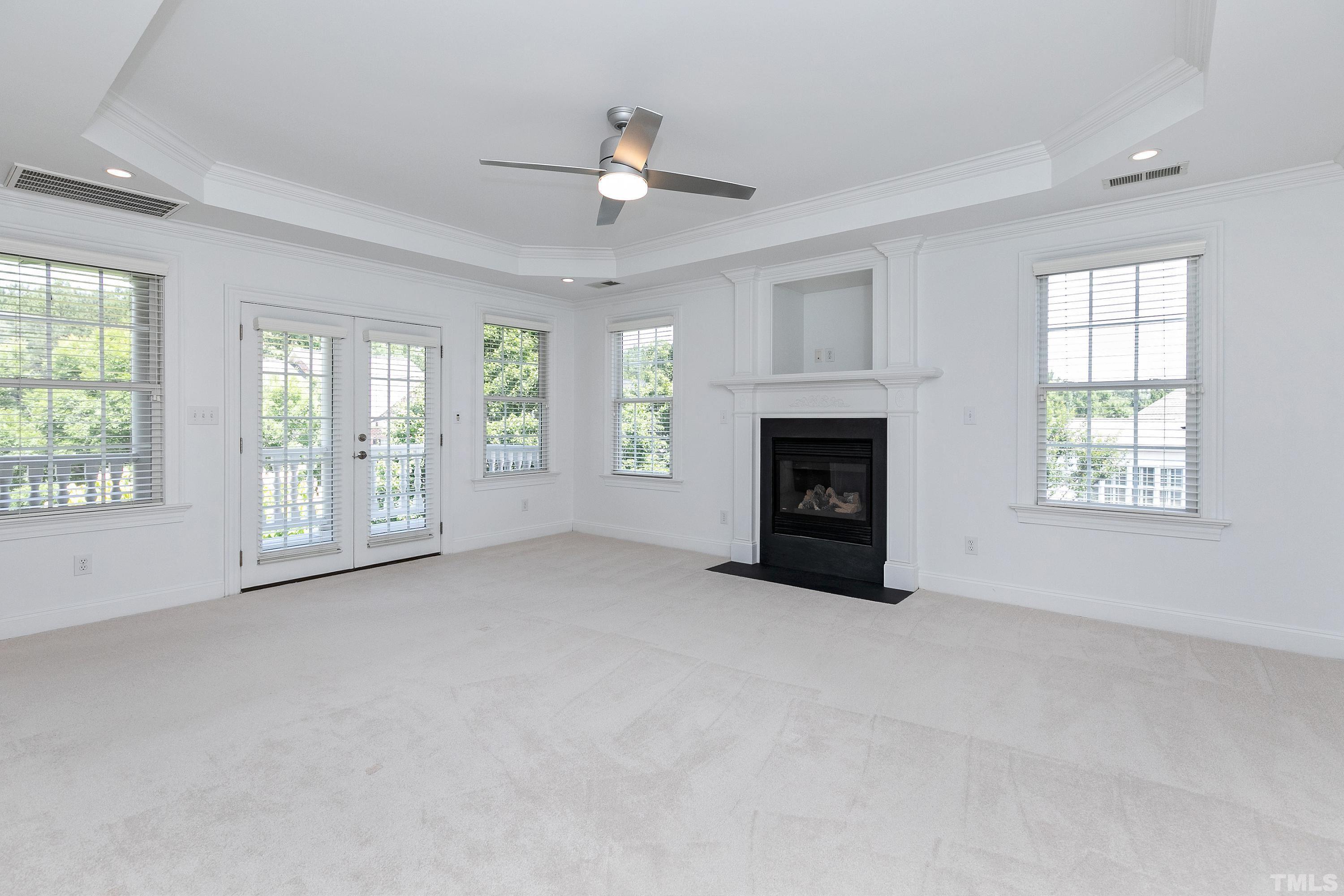 202 Simerville Road Chapel Hill, NC 27517 - Photo 23 of 51 wooden floor fireplace and windows in an empty room