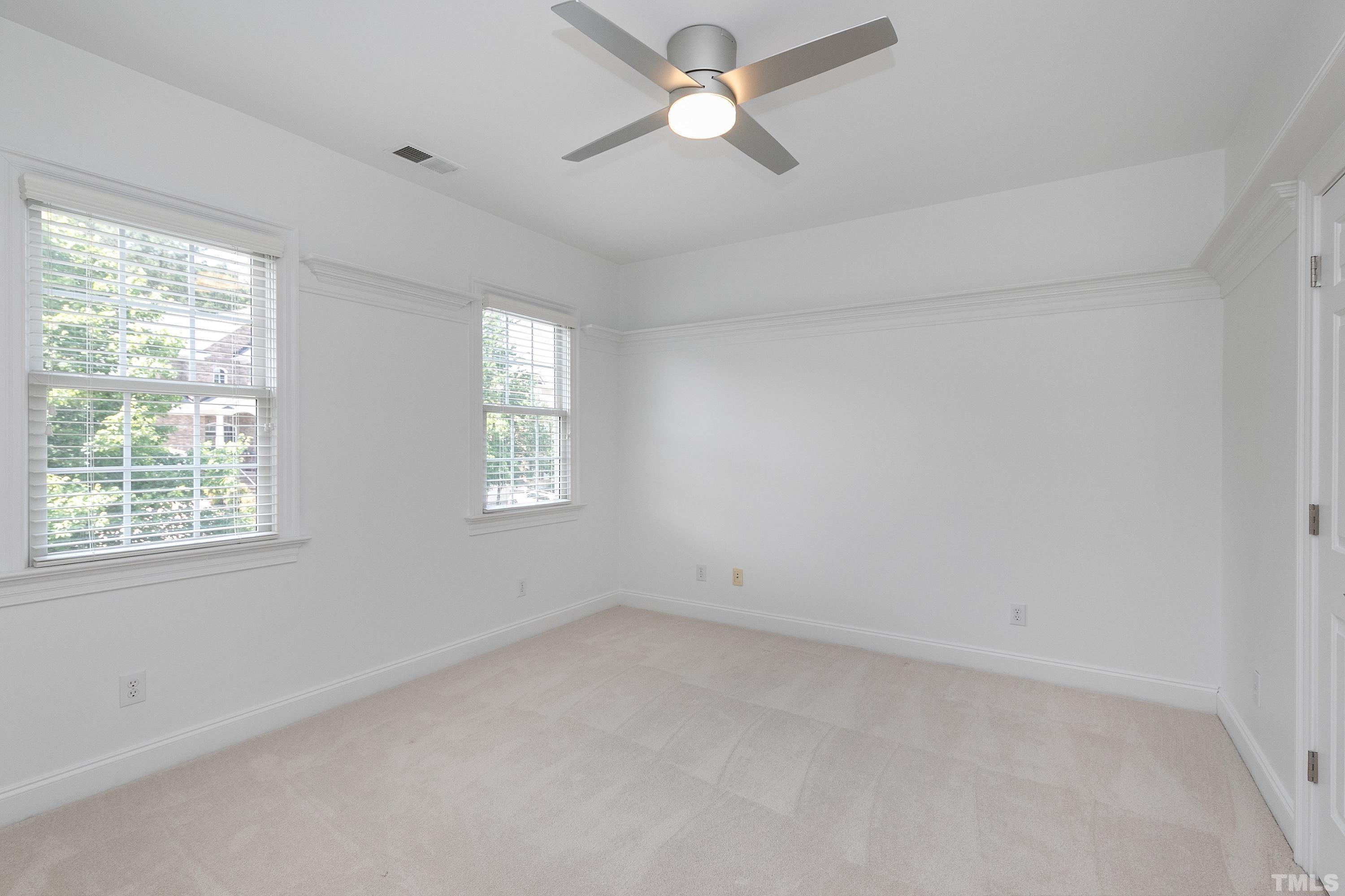 202 Simerville Road Chapel Hill, NC 27517 - Photo 33 of 51 an empty room with a window and a fan