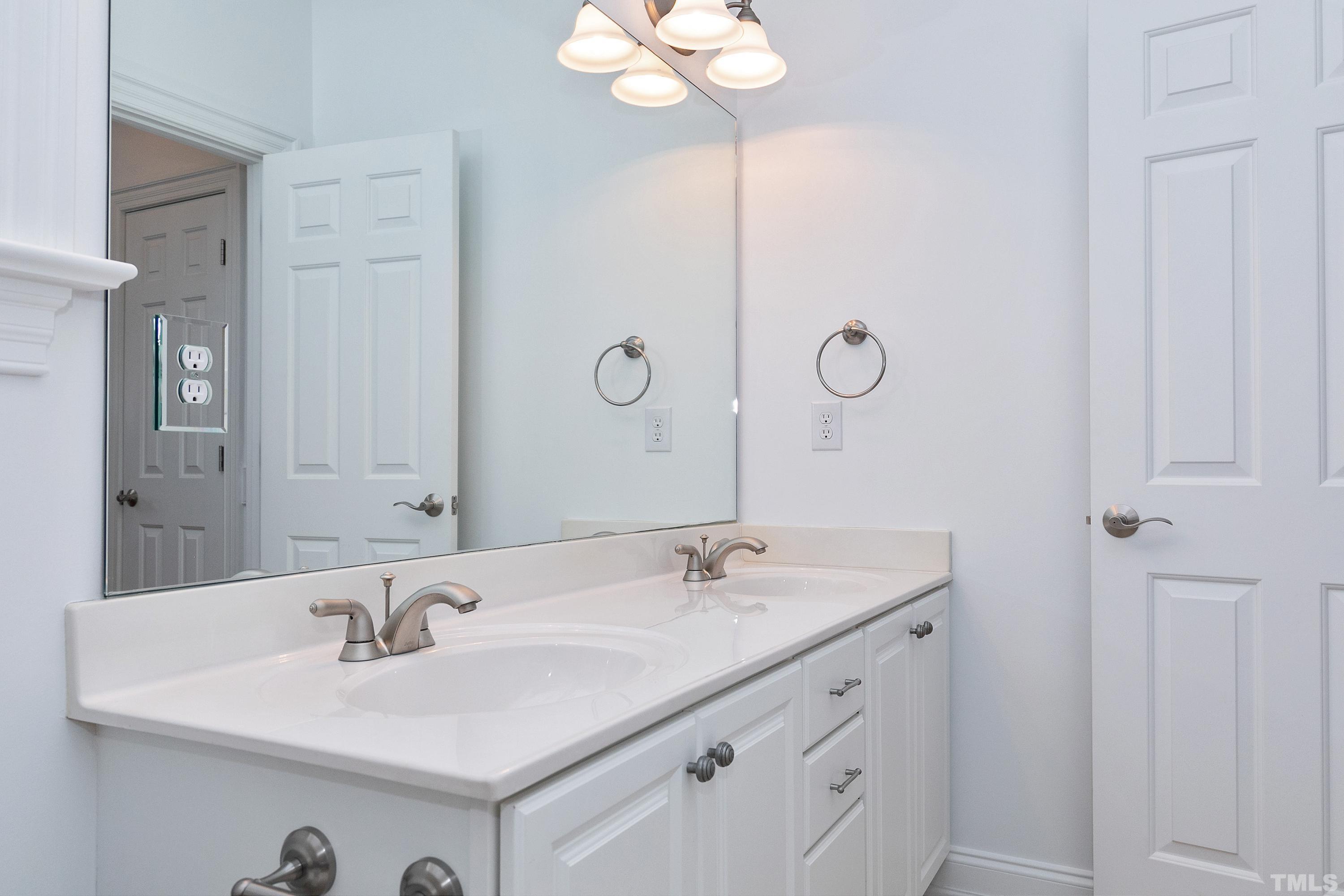 202 Simerville Road Chapel Hill, NC 27517 - Photo 35 of 51 a bathroom with a sink vanity and a mirror