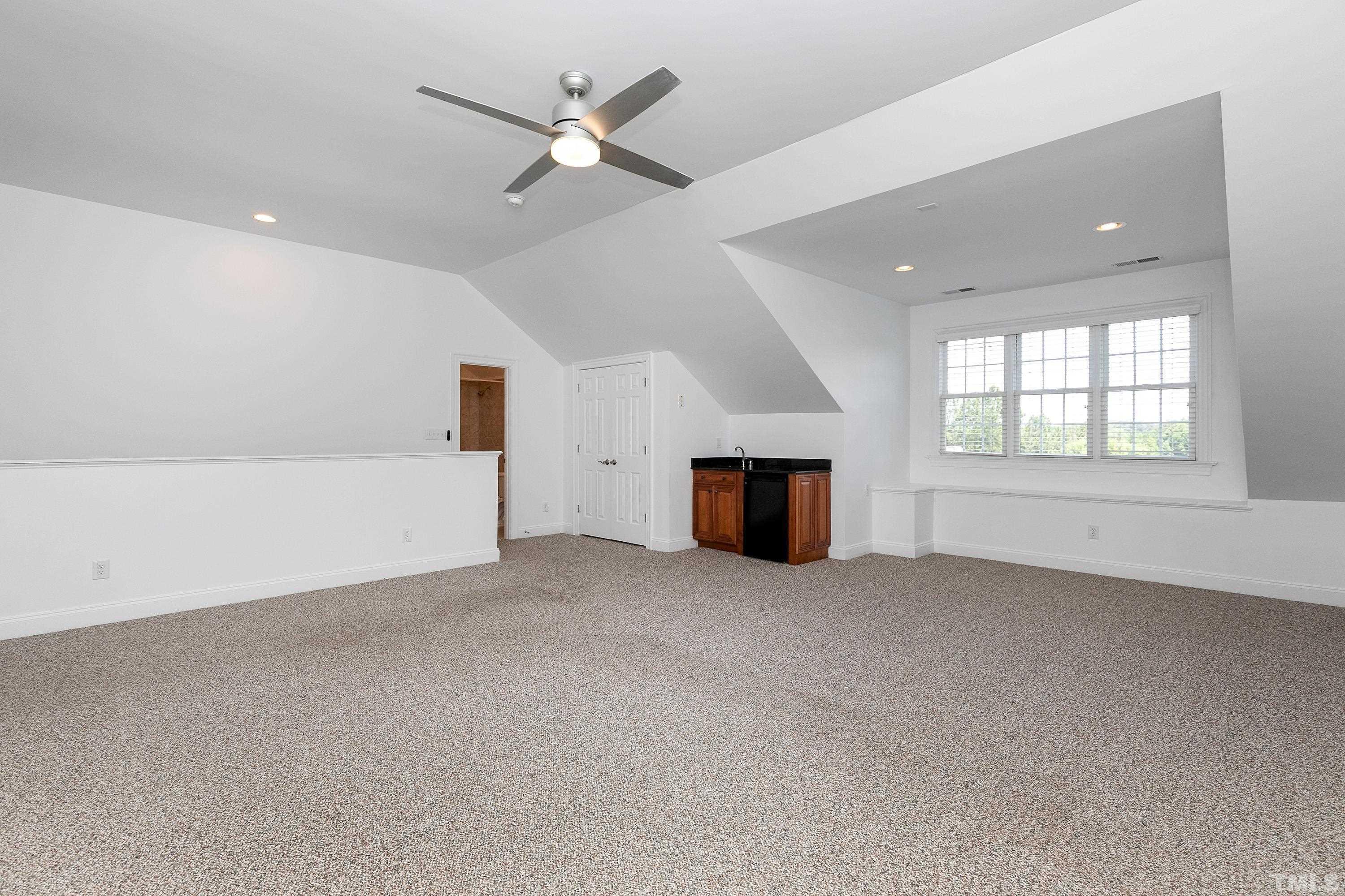 202 Simerville Road Chapel Hill, NC 27517 - Photo 38 of 51 an empty room with fireplace and windows