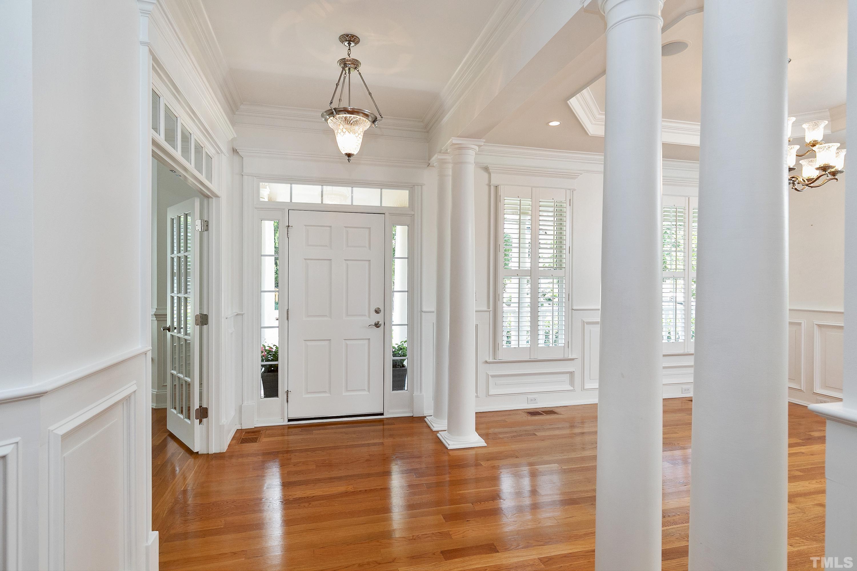202 Simerville Road Chapel Hill, NC 27517 - Photo 4 of 51 a view of a hallway with windows and chandelier