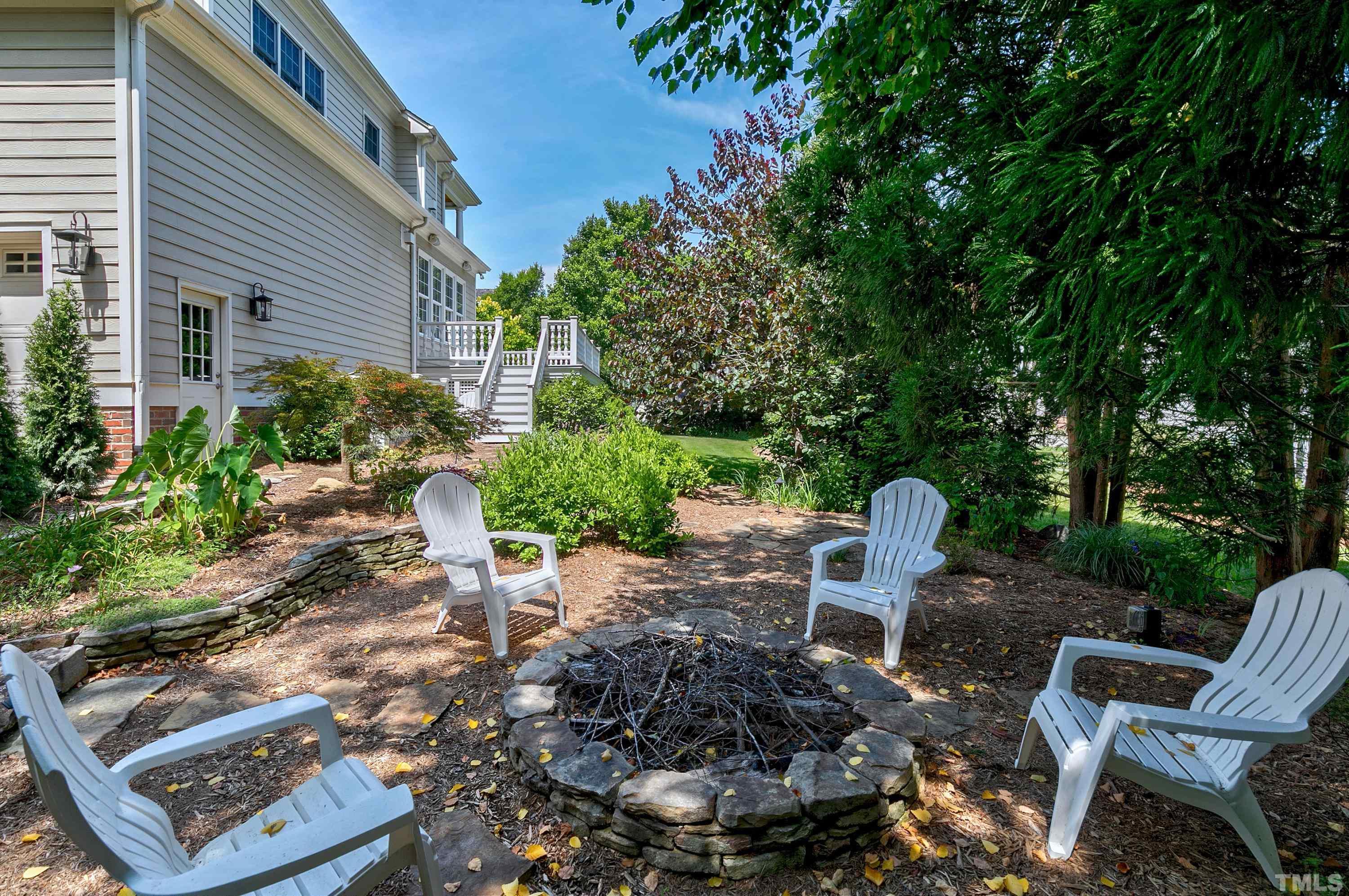202 Simerville Road Chapel Hill, NC 27517 - Photo 46 of 51 a backyard of a house with a garden and outdoor seating
