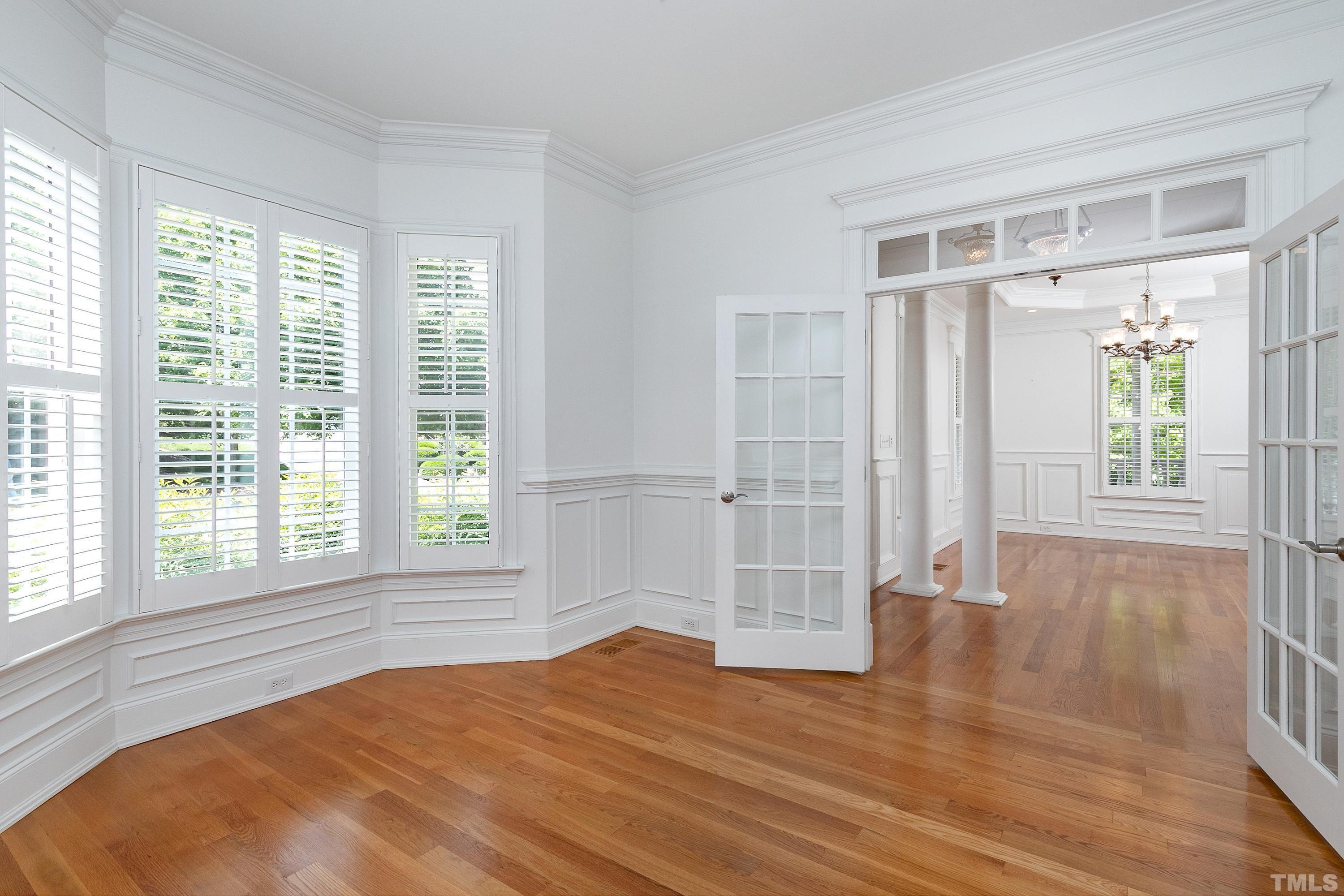 202 Simerville Road Chapel Hill, NC 27517 - Photo 8 of 51 a view of an empty room with wooden floor and a window