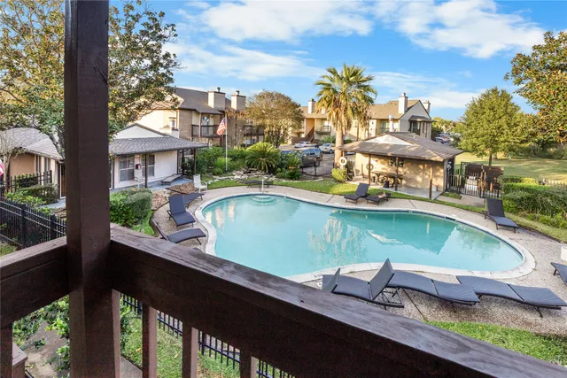 a view of swimming pool from a balcony