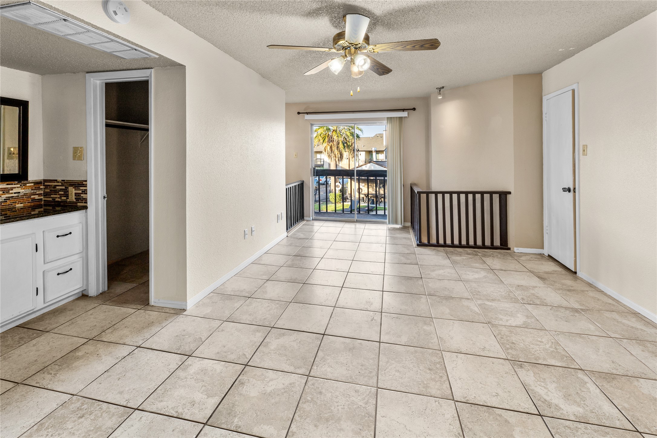 1500 Bay Area Boulevard, Unit 138 Houston, TX 77058 - Photo 10 of 13 a view of a livingroom with a chandelier fan and windows