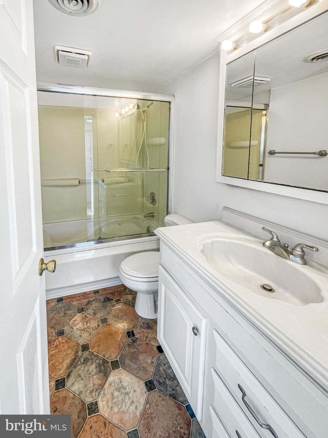 1436 Light Street Baltimore, MD 21230 - Photo 21 of 21 a bathroom with a sink toilet and shower