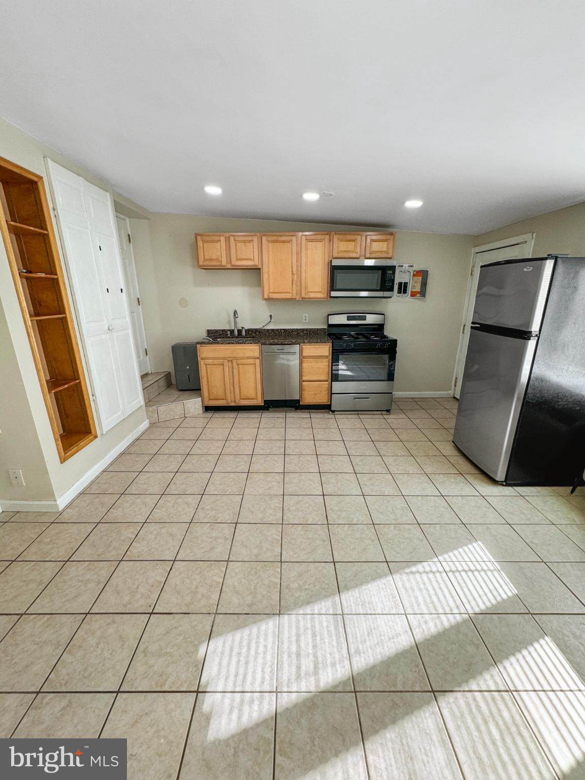 1436 Light Street Baltimore, MD 21230 - Photo 5 of 21 a view of kitchen with stainless steel appliances kitchen island granite countertop a refrigerator and a stove top oven