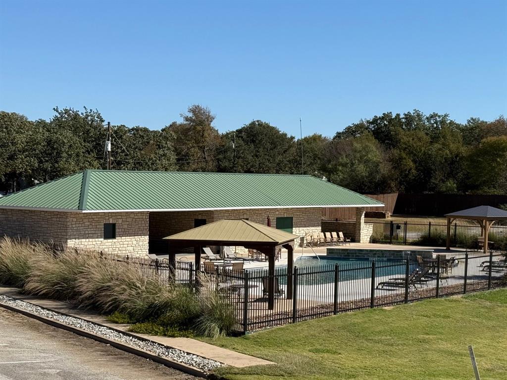 363 Three Forks Chico, TX 76431 - Photo 4 of 8 an outdoor space with furniture and umbrella