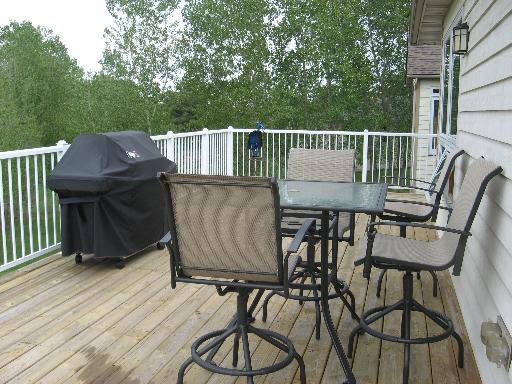 2704 Rolling Oaks Road Spring Grove, IL 60081 - Photo 14 of 16 a view of a chairs and table on the wooden floor