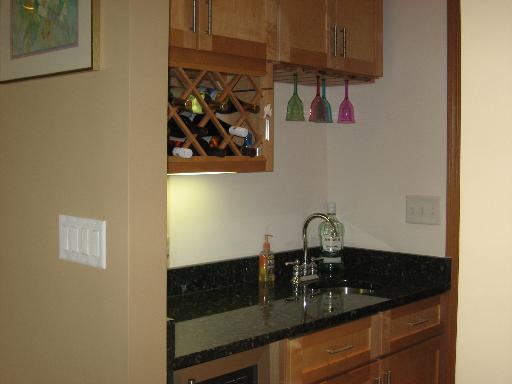 2704 Rolling Oaks Road Spring Grove, IL 60081 - Photo 8 of 16 a sink with granite countertop lots of different kinds of food