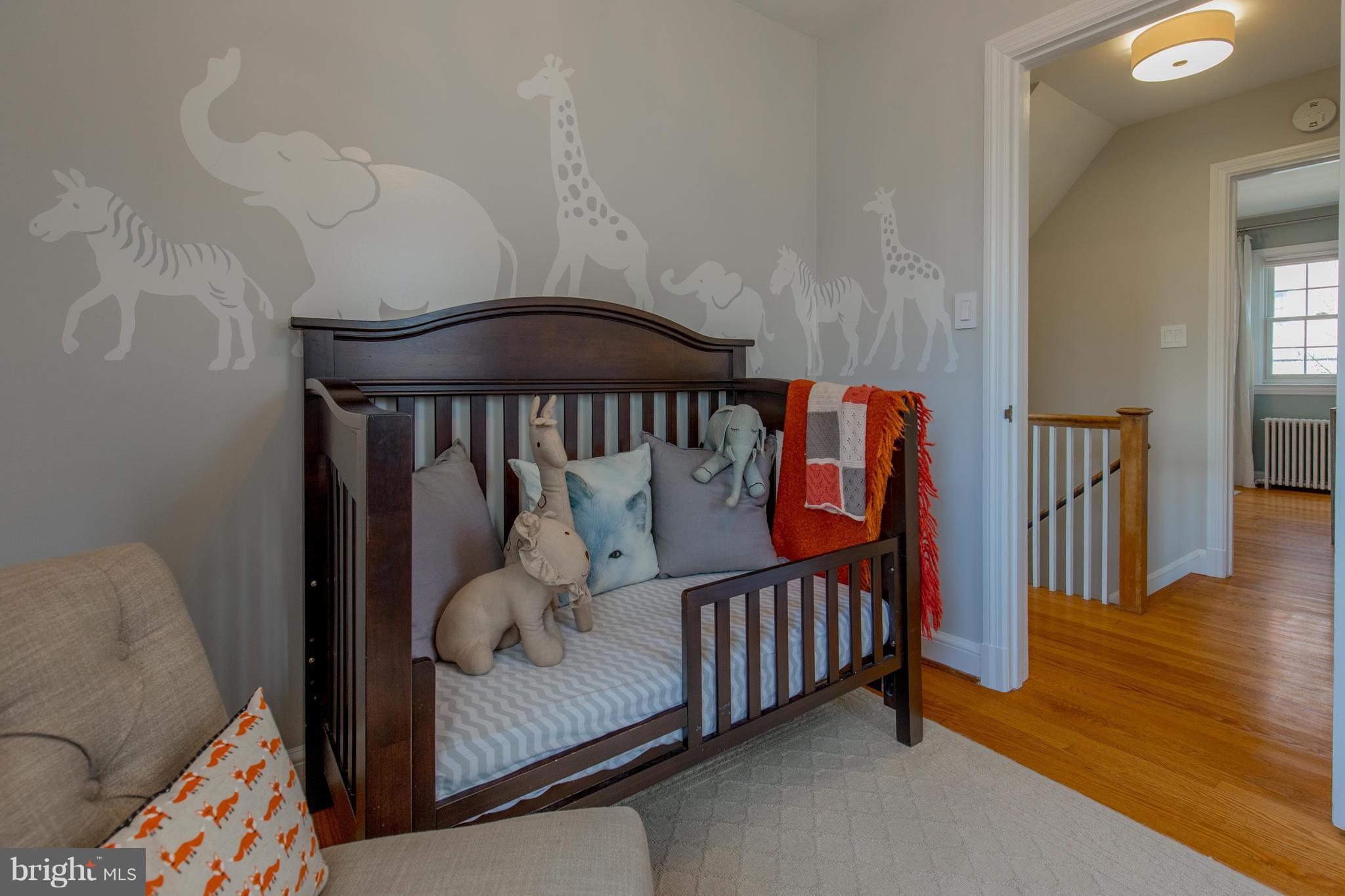 9505 Thornhill Road Silver Spring, MD 20901 - Photo 22 of 30 a view of a bedroom with furniture and wooden floor
