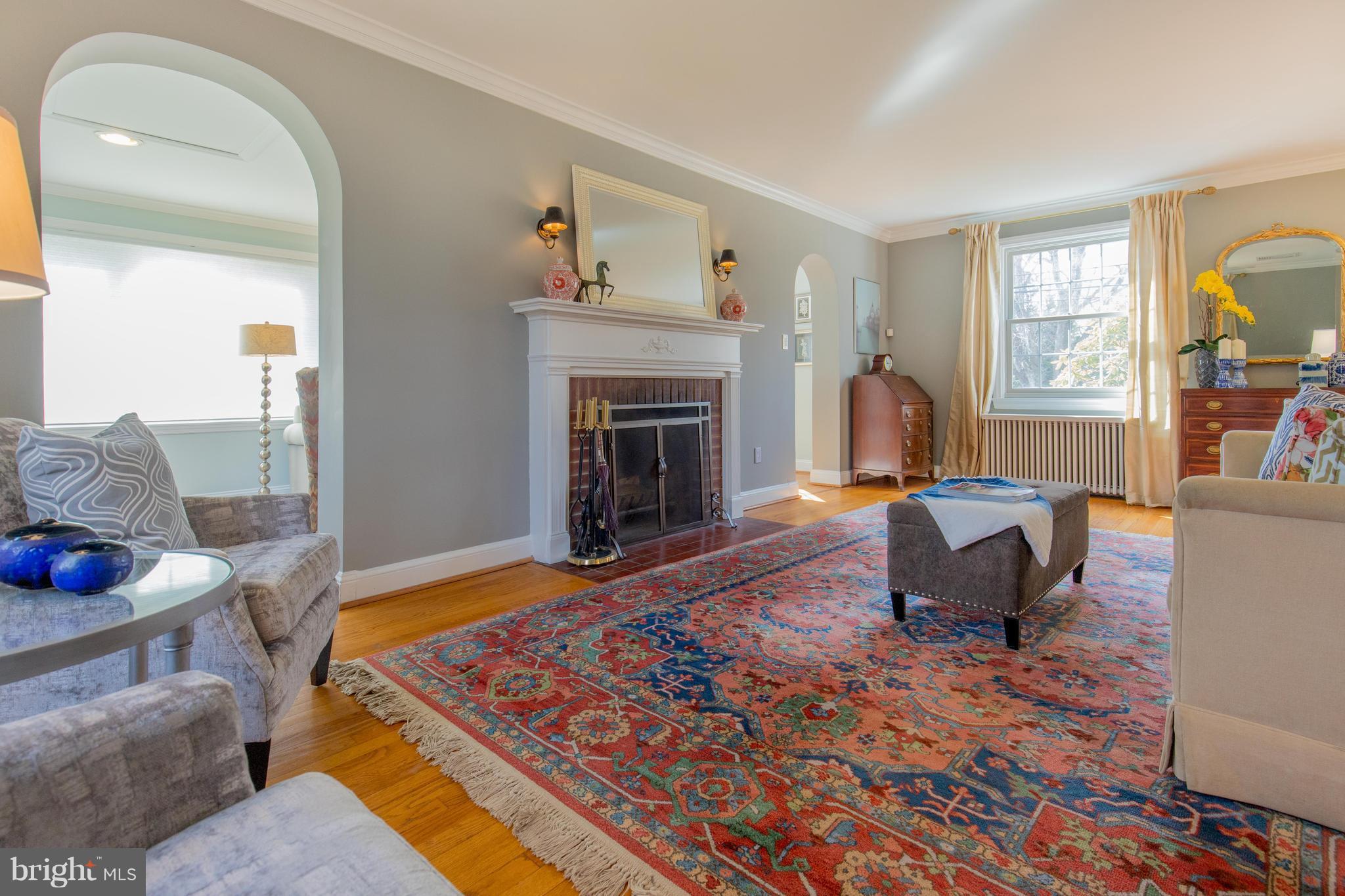 9505 Thornhill Road Silver Spring, MD 20901 - Photo 5 of 30 a living room with furniture and a fireplace