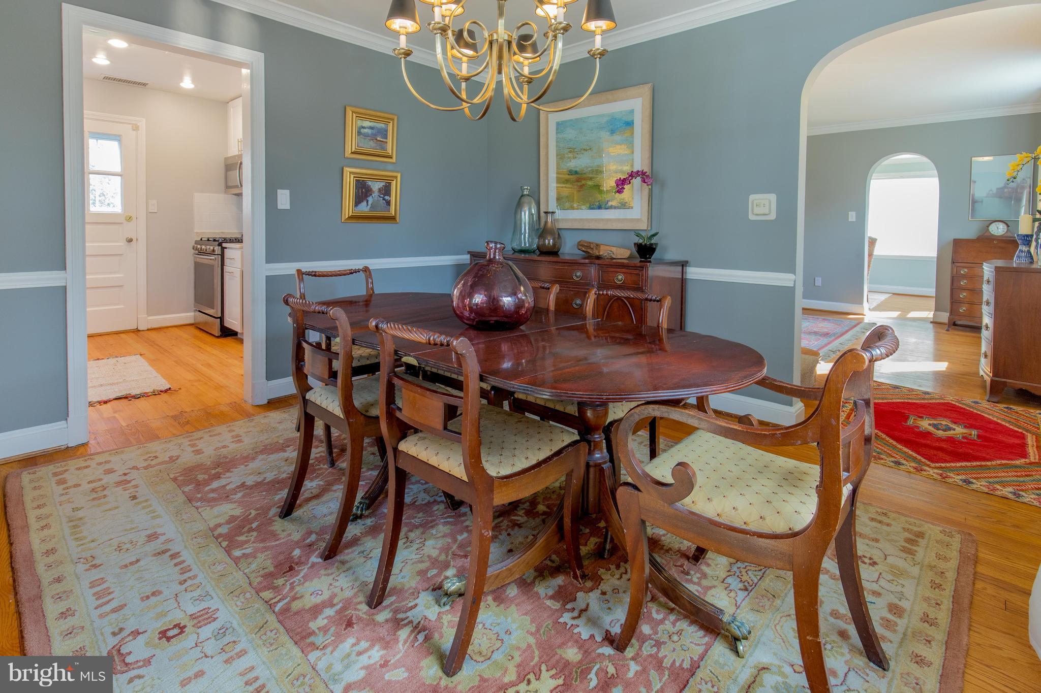 9505 Thornhill Road Silver Spring, MD 20901 - Photo 8 of 30 a view of a dining room with furniture and a chandelier