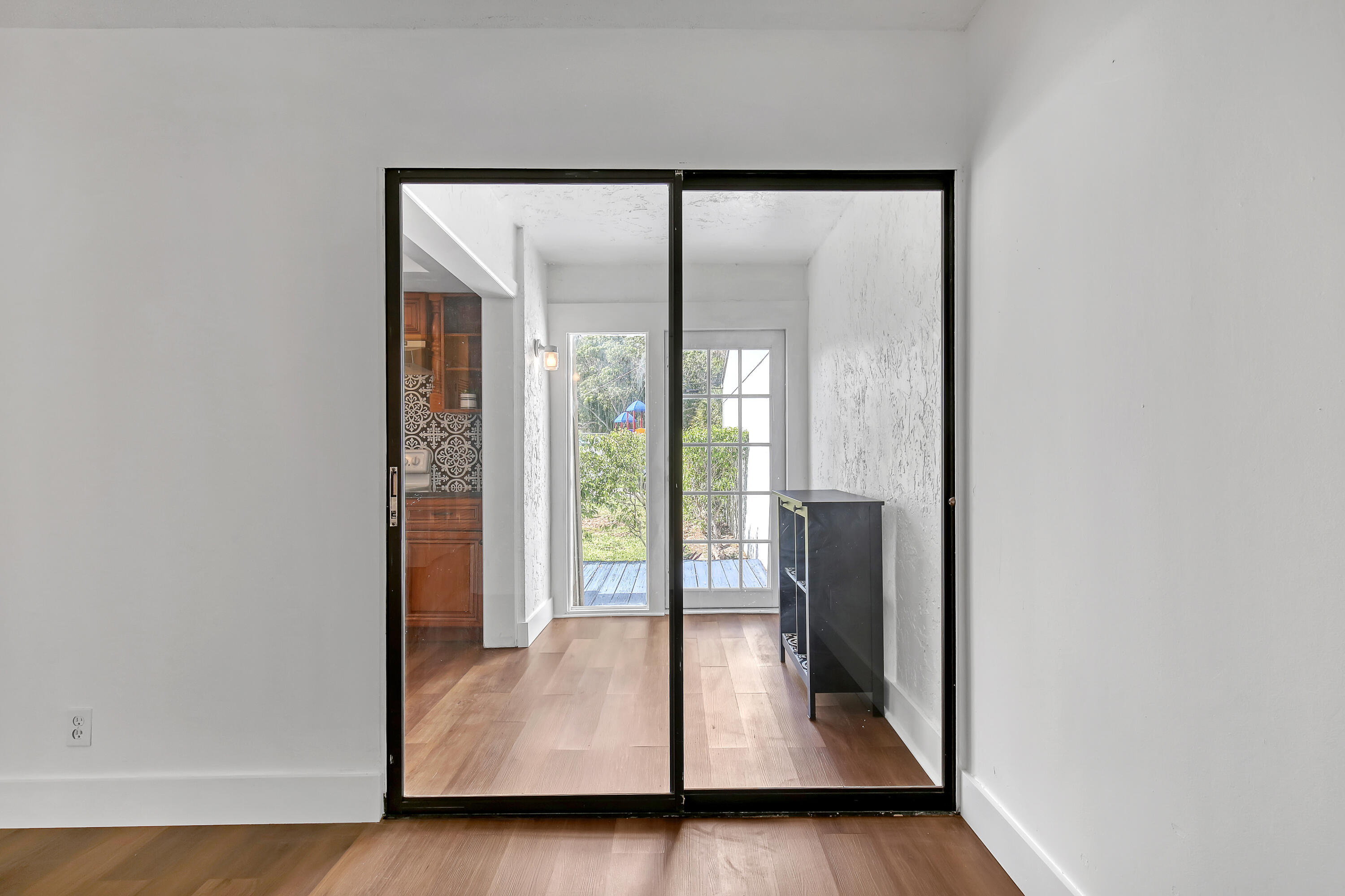 241 Northwest 15th Street Boca Raton, FL 33432 - Photo 18 of 34 an empty room with wooden floor and windows