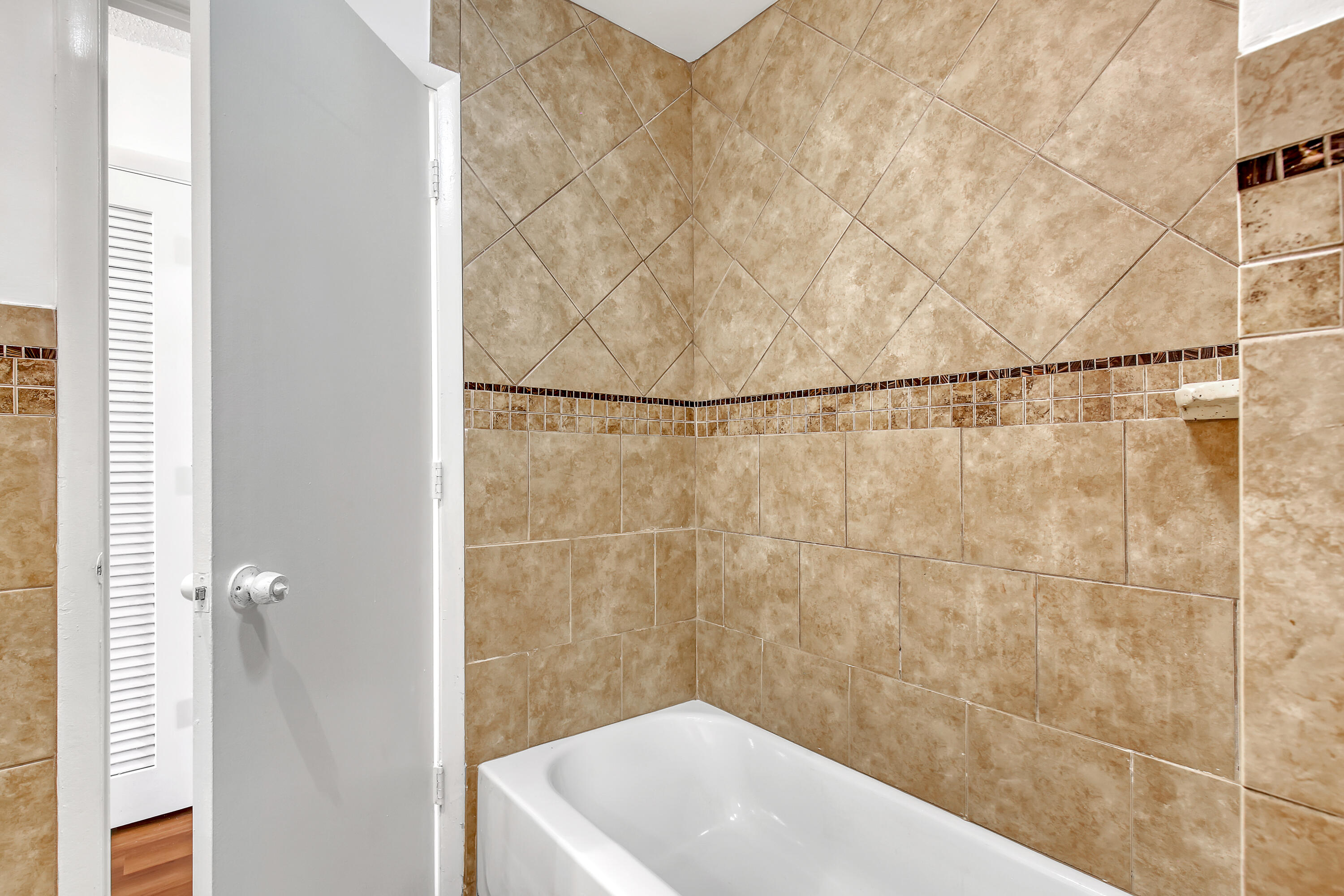 241 Northwest 15th Street Boca Raton, FL 33432 - Photo 20 of 34 a bathroom with a white bath tub and a shower