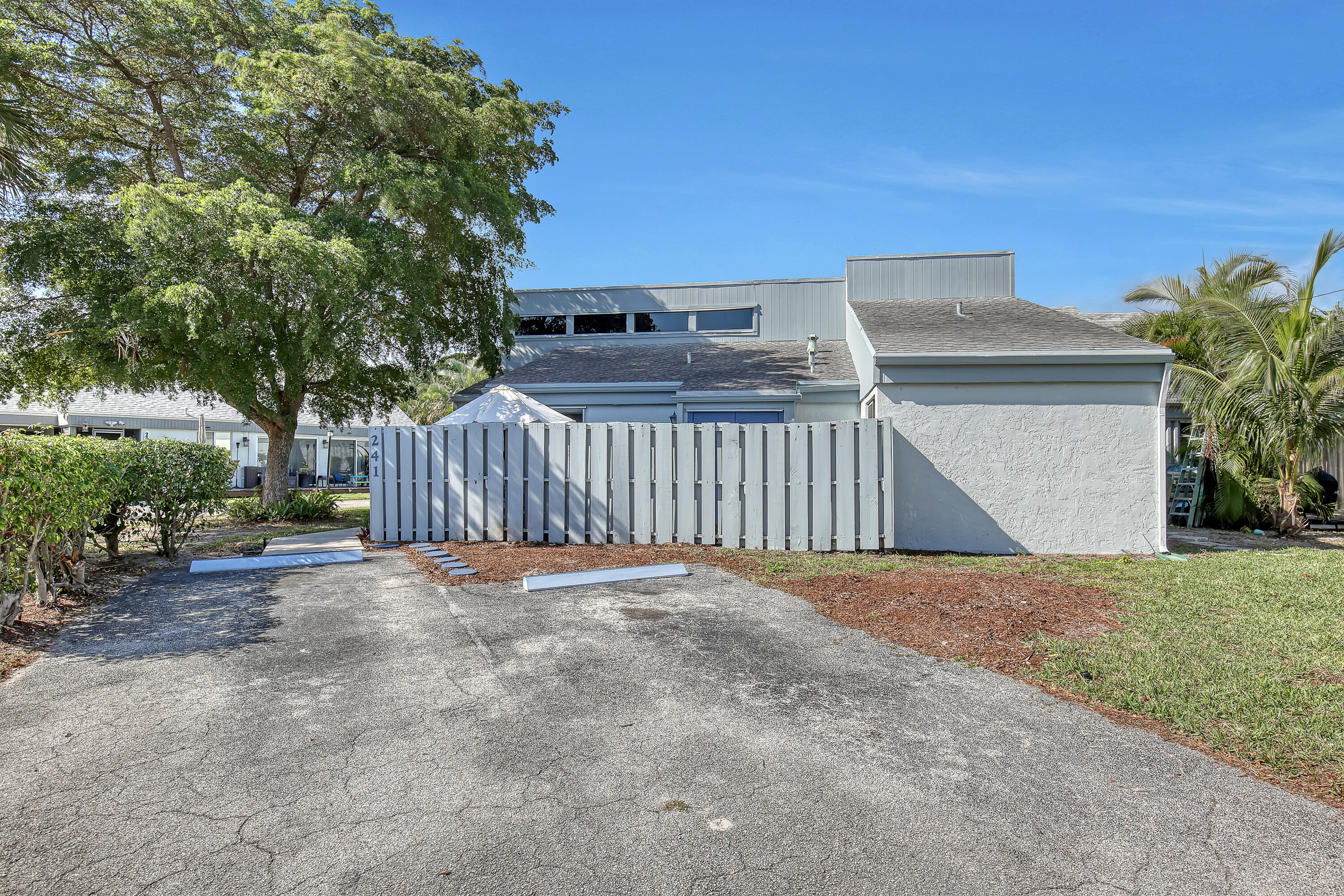 241 Northwest 15th Street Boca Raton, FL 33432 - Photo 2 of 34 a view of basketball place with wooden fence