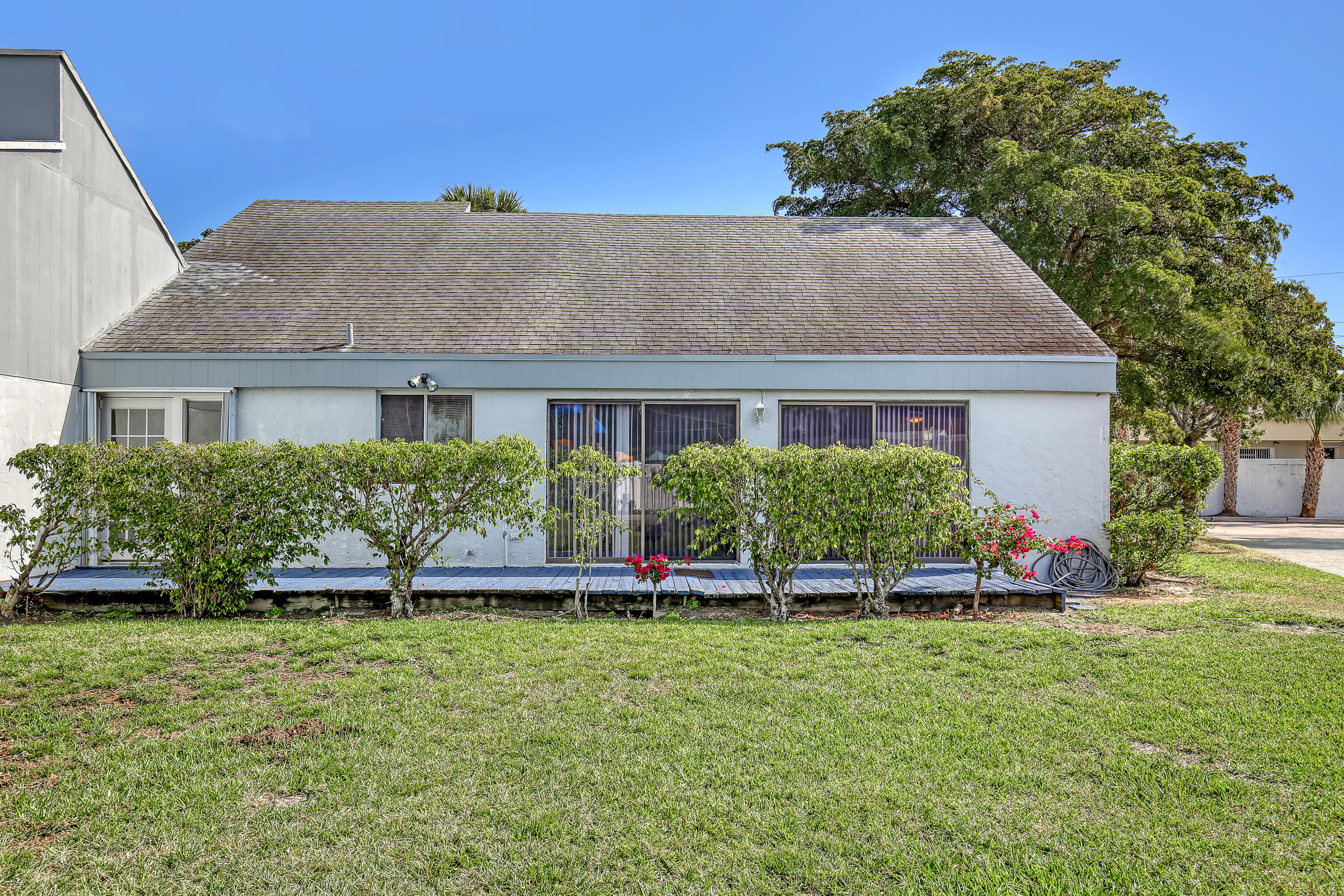 241 Northwest 15th Street Boca Raton, FL 33432 - Photo 34 of 34 a front view of a house with a yard