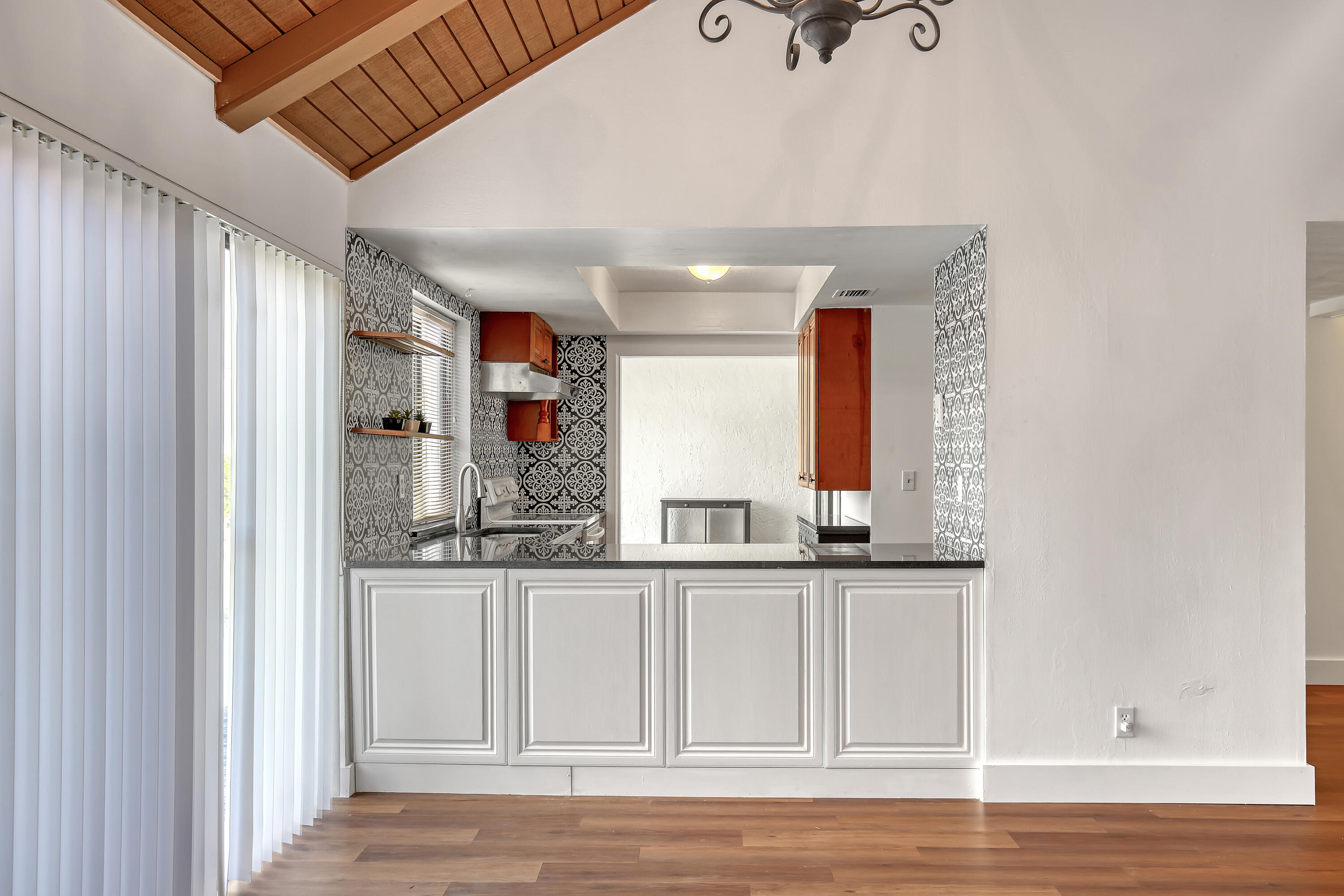 241 Northwest 15th Street Boca Raton, FL 33432 - Photo 9 of 34 a view of a kitchen from the hallway