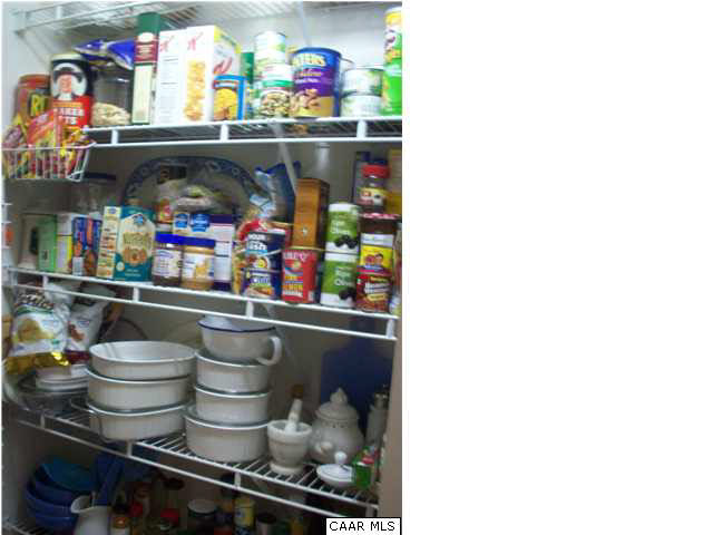 91 Riverside Drive Palmyra, VA 22963 - Photo 12 of 31 a store room with lots of clutter and refrigerator