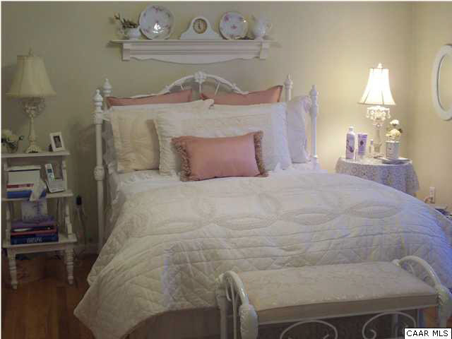 91 Riverside Drive Palmyra, VA 22963 - Photo 17 of 31 a large bed sitting in a bedroom next to a window