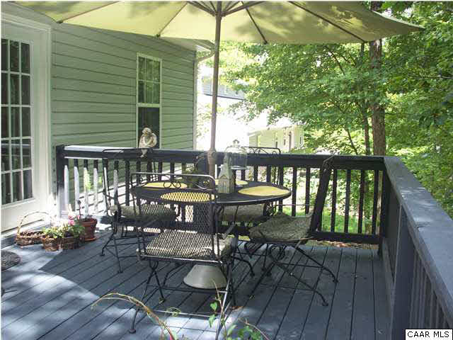 91 Riverside Drive Palmyra, VA 22963 - Photo 29 of 31 a balcony with wooden floor table and chairs
