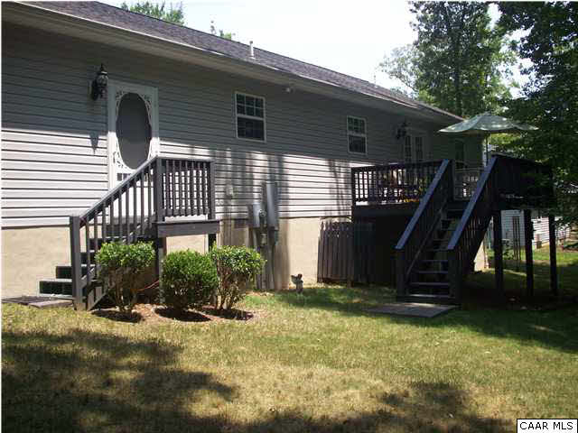 91 Riverside Drive Palmyra, VA 22963 - Photo 4 of 31 a front view of a house with garden