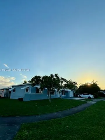 a view of house with outdoor space and seating
