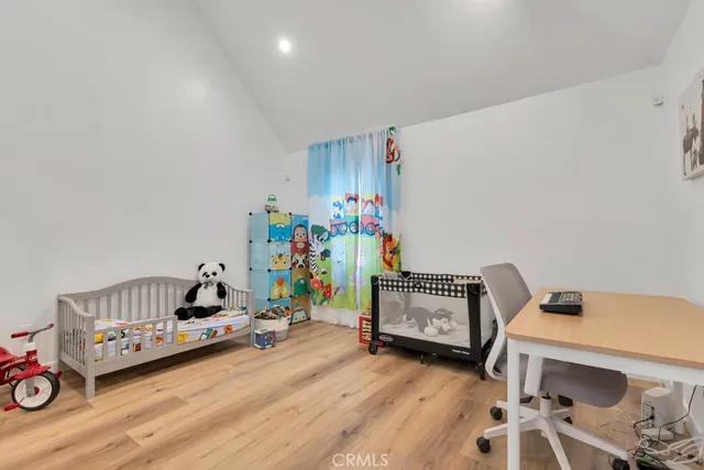 a view of a workspace with furniture and a bedroom