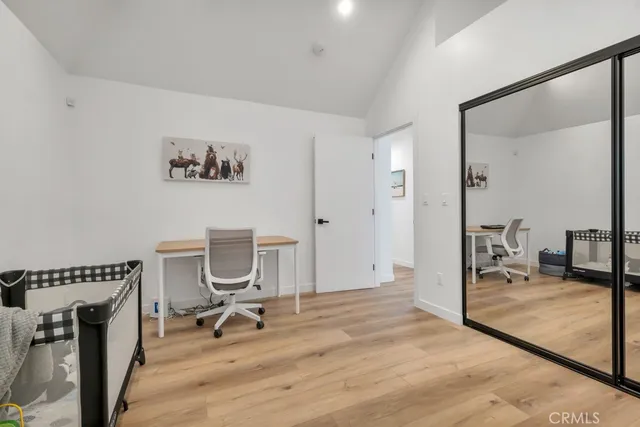 a bathroom with a sink a toilet a shower and a mirror