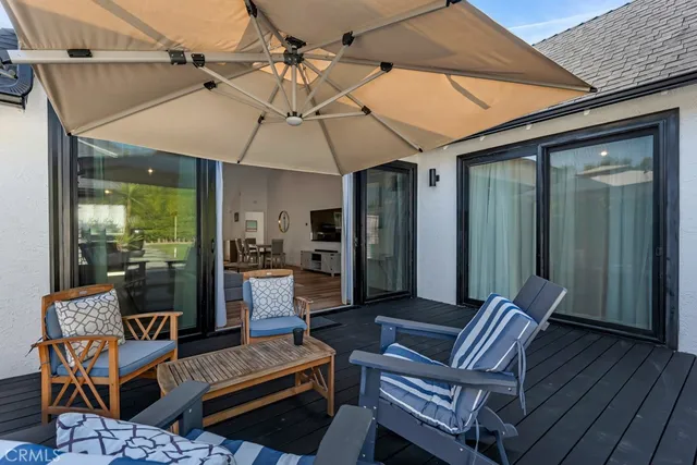 a view of a house with porch and seating space