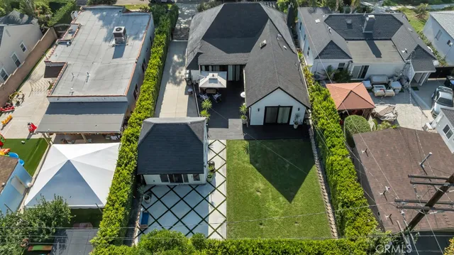 an aerial view of a house with a garden and a garage