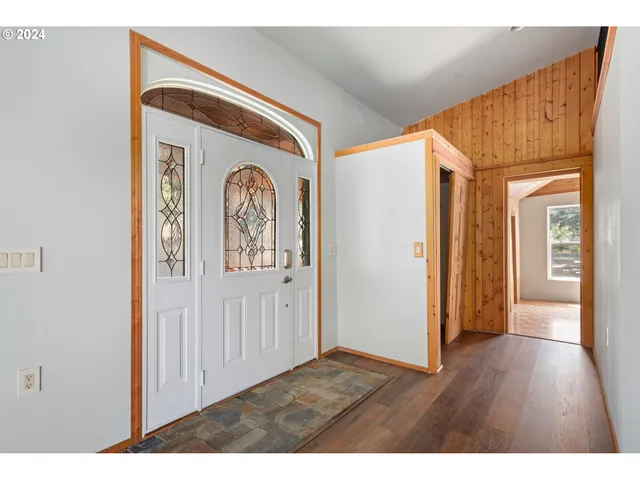 a view of front door with wooden floor