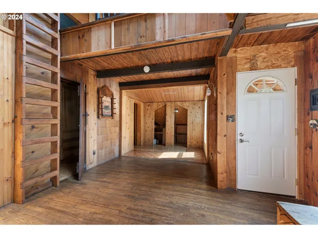 a view of an entryway with wooden floor